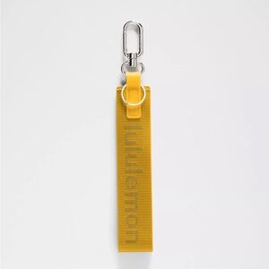 NWT $20 Lululemon Never Lost Keychain Wordmark Maize Yellow Graphite Grey